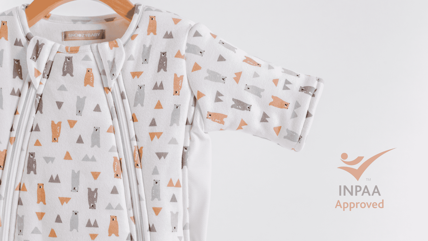 Baby sleepsuit with bear pattern and safety approved INPAA logo