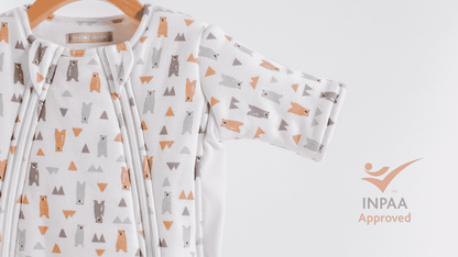 Baby sleepsuit with bear pattern and safety approved INPAA logo