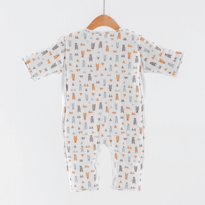 Back of baby transition suit for boys with animal pattern on a hanger against a white background