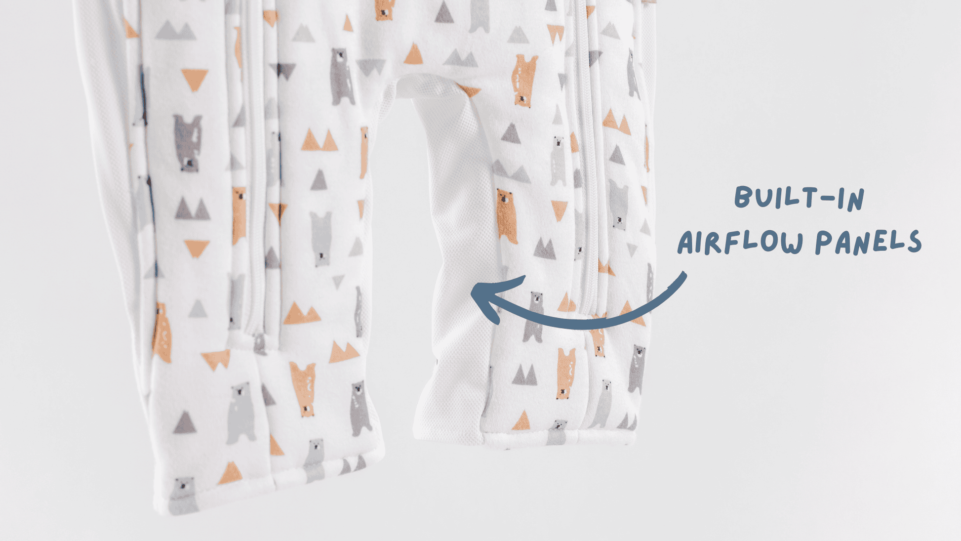 Baby sleepsuit in bear pattern with breathable built-in airflow panels on a white background