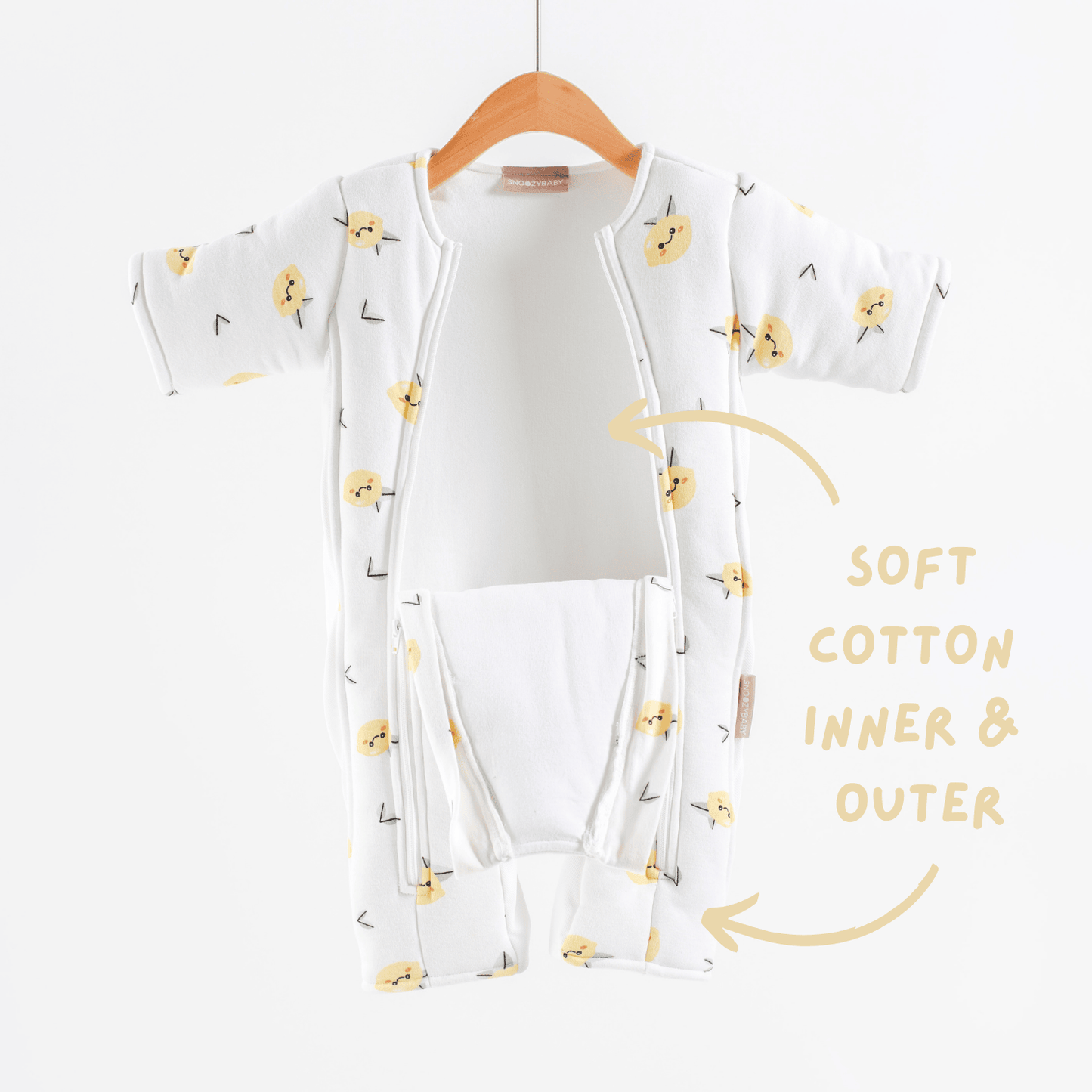 White baby transition suit with lemon pattern on a hanger against a white background highlighting soft cotton fabric inner and outer