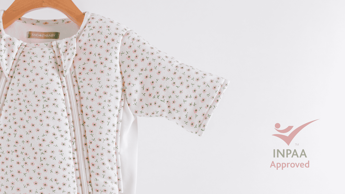 Baby transition bag with floral pattern on a hanger against a white background with INPAA Approved logo